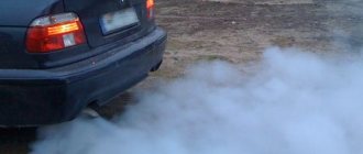 blue smoke from a car chimney