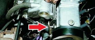 The red arrow indicates the sensor screwed into the engine hole