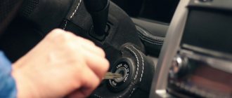 A man inserts the key into the ignition