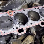 Why does oil leak from under the cylinder head?