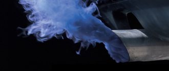 Blue smoke from the exhaust pipe of a gasoline engine